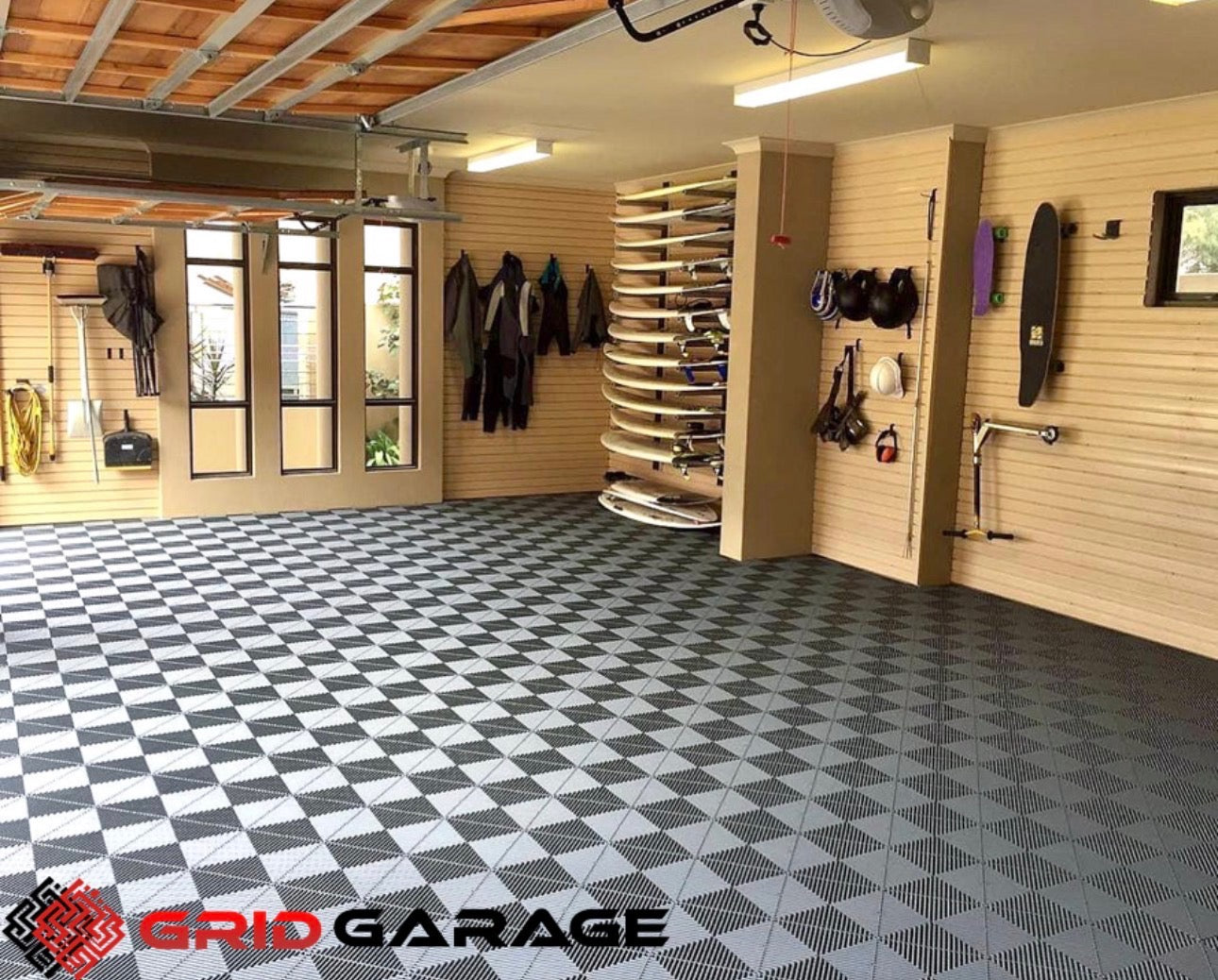 Garage with interlocking floor tiles and wall storage